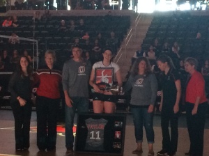 Senior Amy Taylor being presented with her commemorative jersey before the game. 